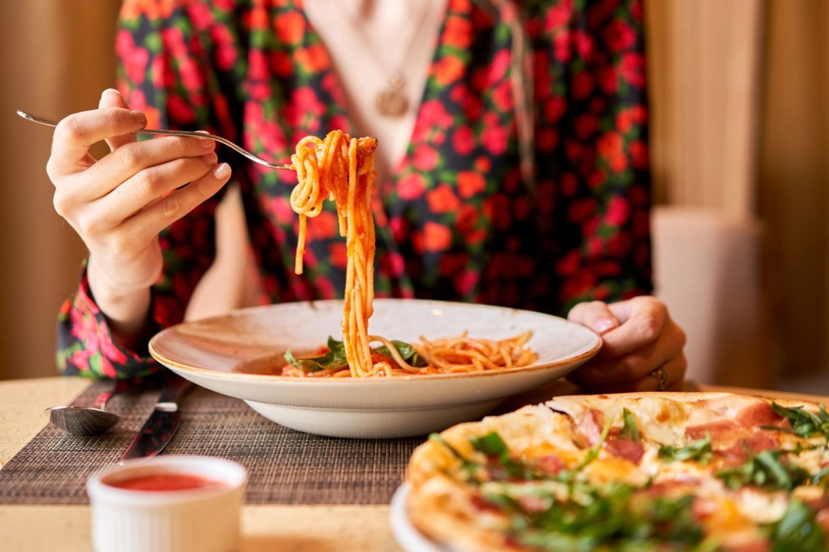 Woman eating pasta