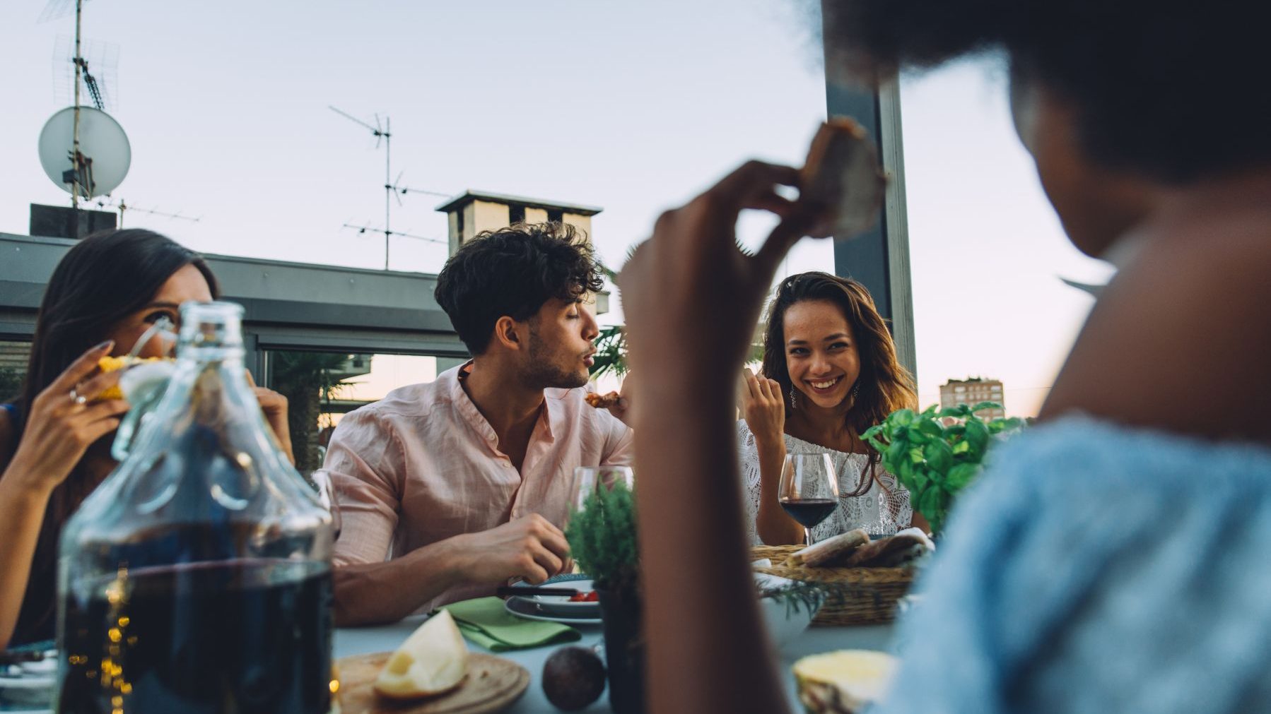 friends dining on a Miami rooftop